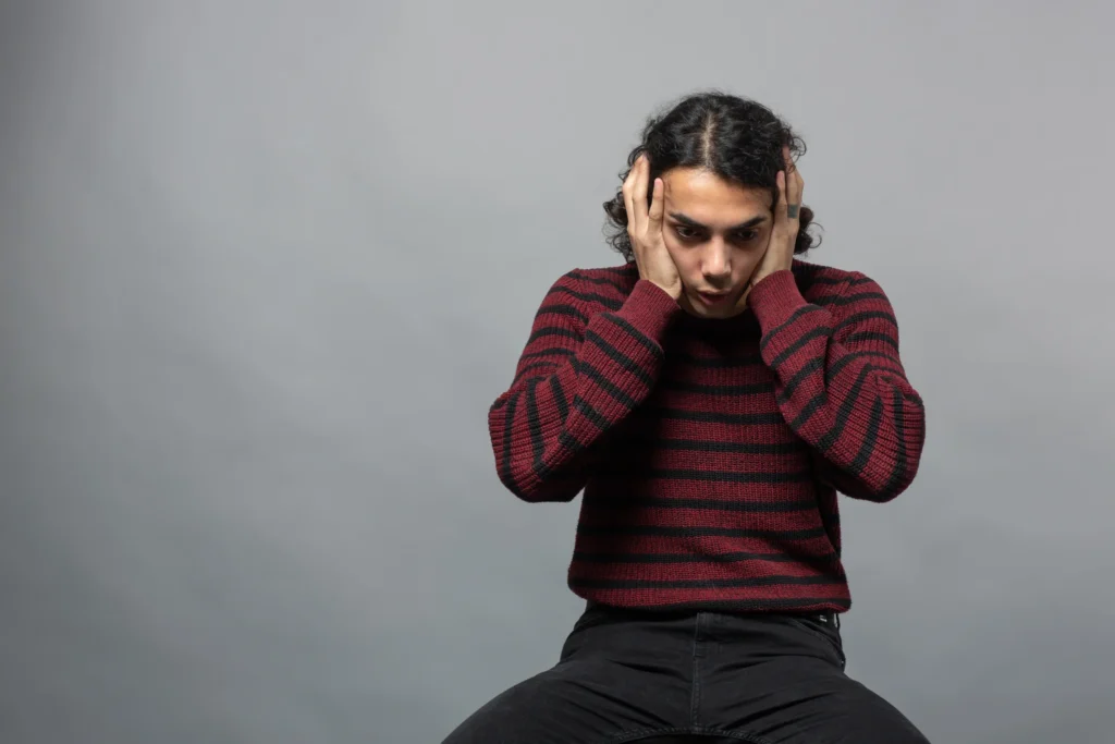 Depression Counseling in Gurgaon 24 guy confused holding his head scaled 1