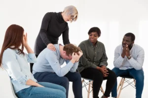 blonde woman taking care male rehab patient