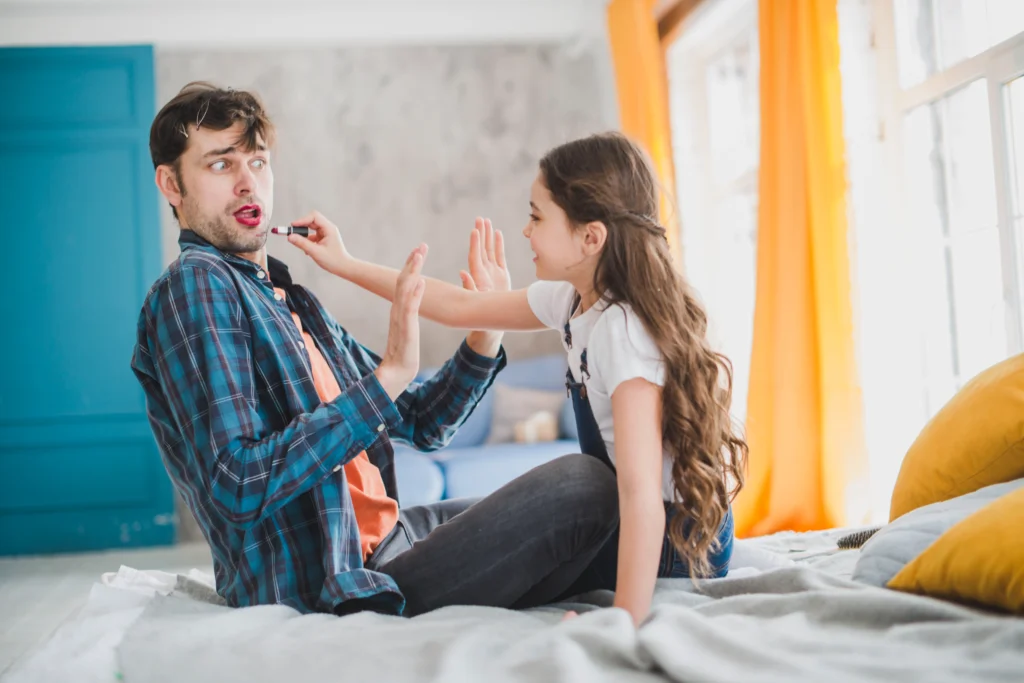 Marriage Counseling in Gurgaon 22 fathers day concept with daughter painting fathers lips