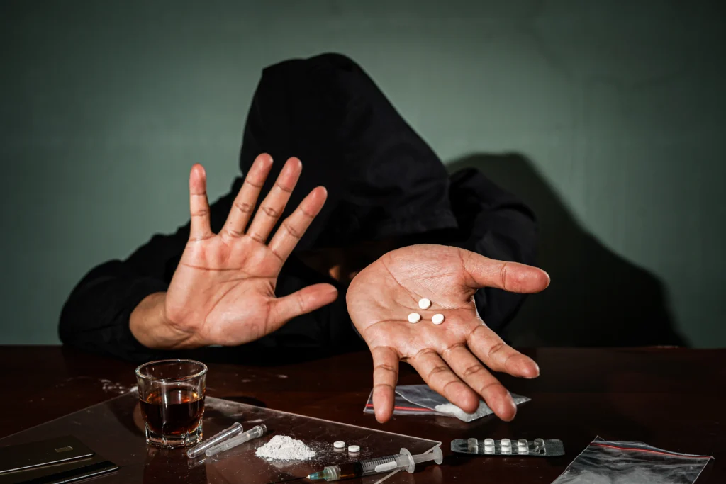 Addiction Counseling in Gurgaon 19 man hand holds plastic packet drugs bag with cocaine drug abuse danger addiction concept