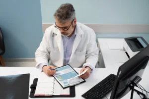 medium shot doctor filling document high angle