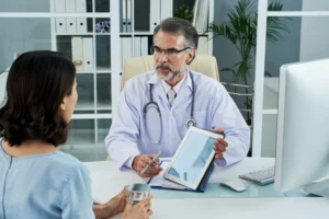medium shot middle aged doctor explaining diagnosis via tablet pc