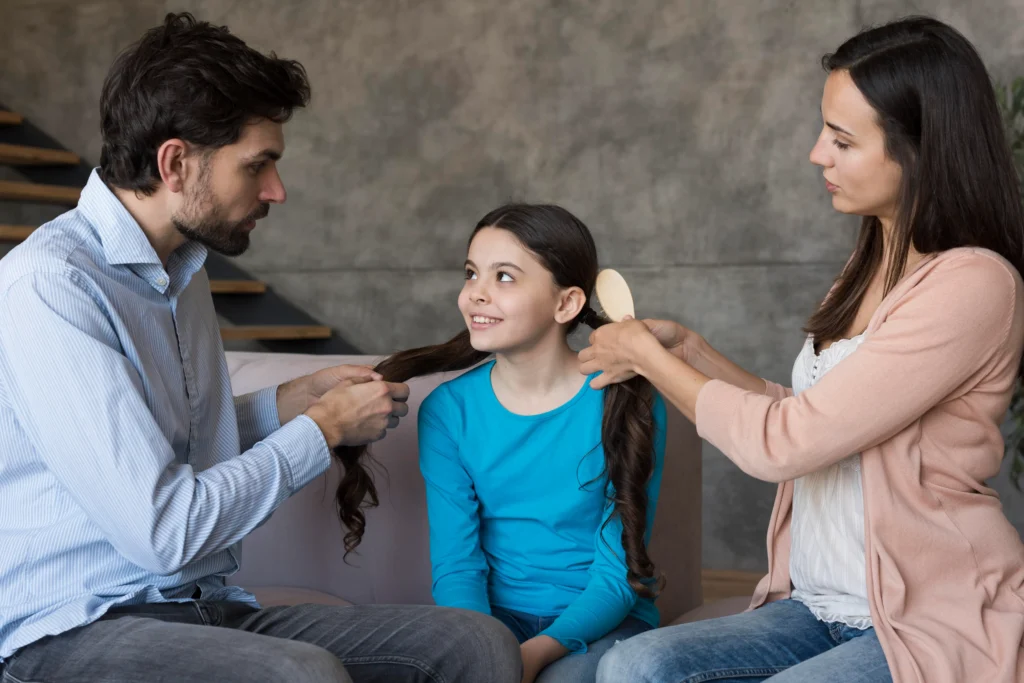 Family Counselling in Gurgaon 23 parents brushing daughter hair