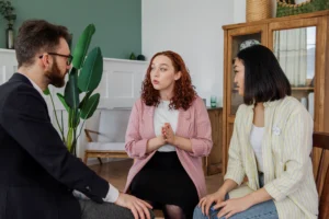 people having debate while looking computer 1