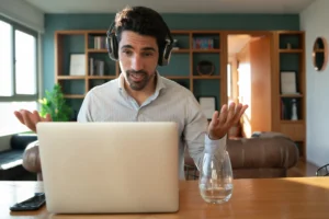 portrait young man work video call with laptop from home home office concept new normal lifestyle scaled 1