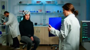 professional doctor neurological medicine testing eyesight patient with eeg headset