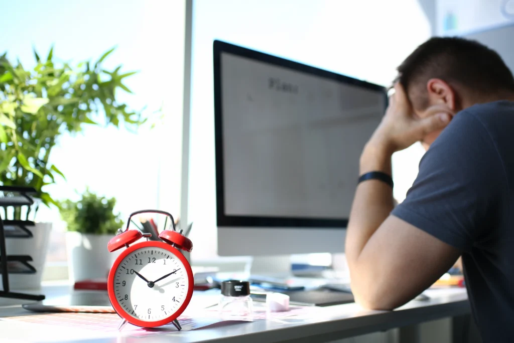 Best Online Sleep Therapy In Gurugram 21 red alarm clock stand worktable with thoughtful man