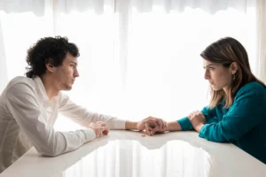 sad couple holding hands 1