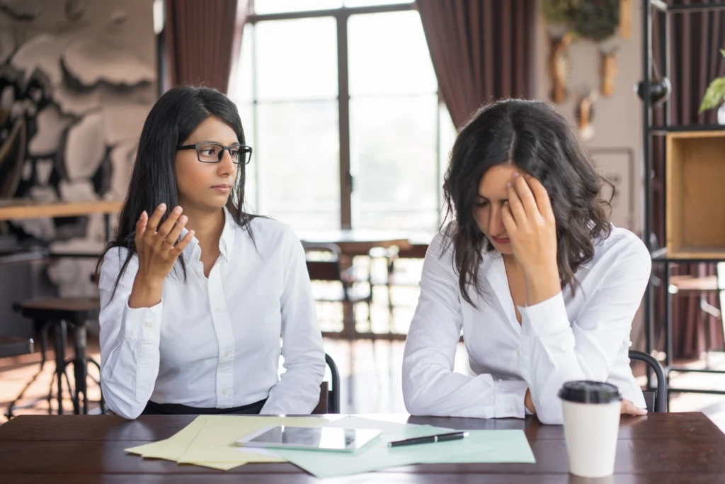 serious business woman accusing colleague making mistake 1
