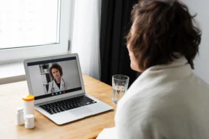 sick young man talking his doctor online