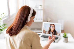 woman work having video call laptop