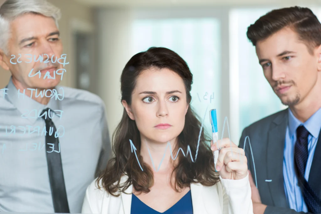 business people discussing graph glass screen