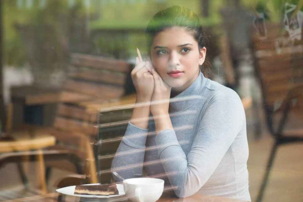 calm indian student girl spending leisure cafe