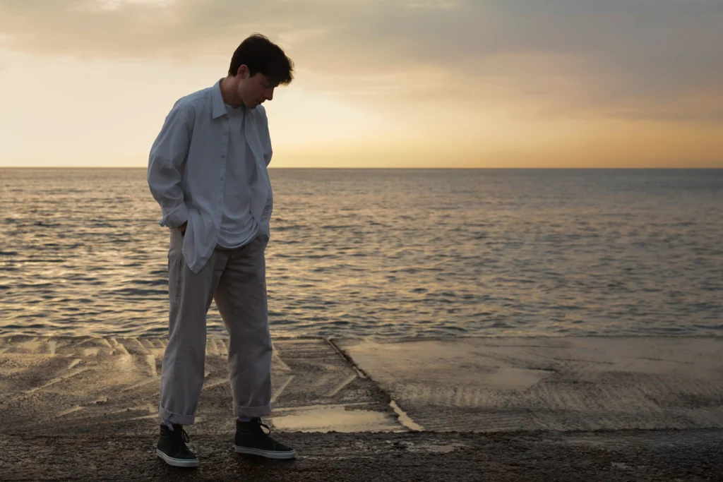 full shot contemplative man seaside