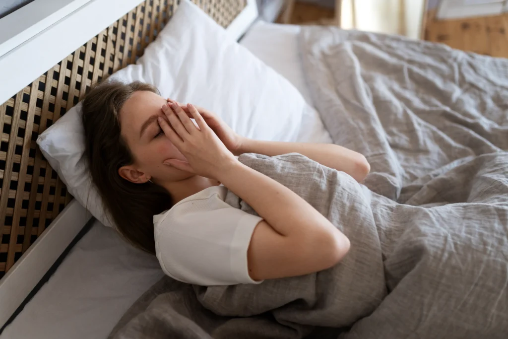 high angle anxious woman laying bed