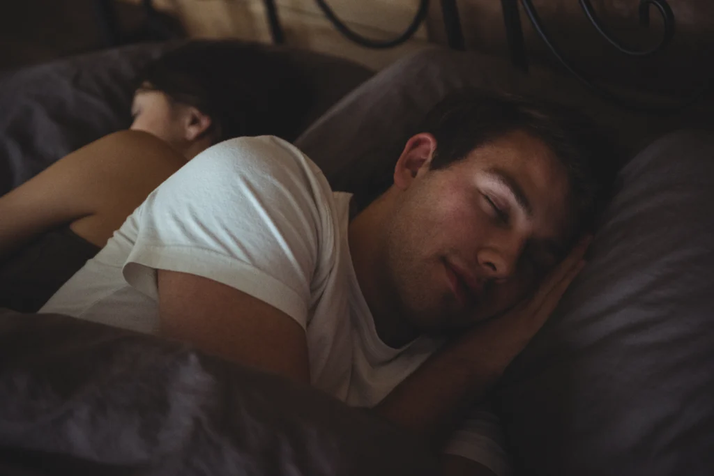 couple sleeping bed bedroom