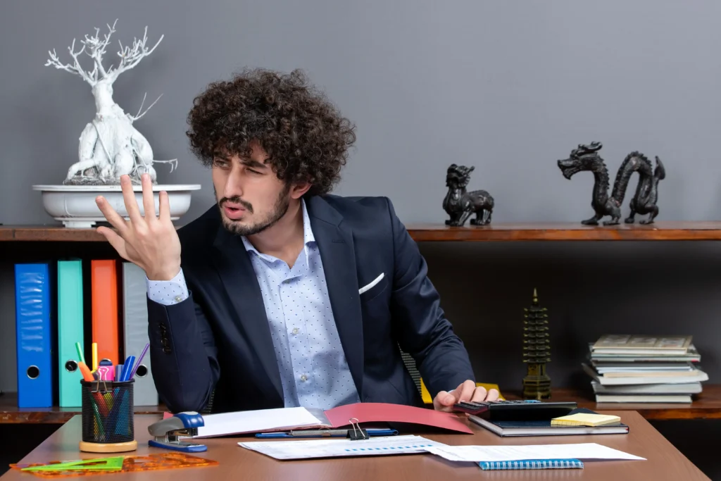 front view dissatisfied businessman sitting desk office