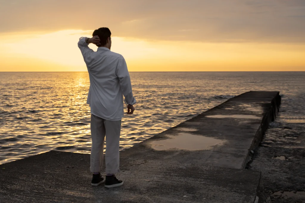 full shot contemplative man seaside