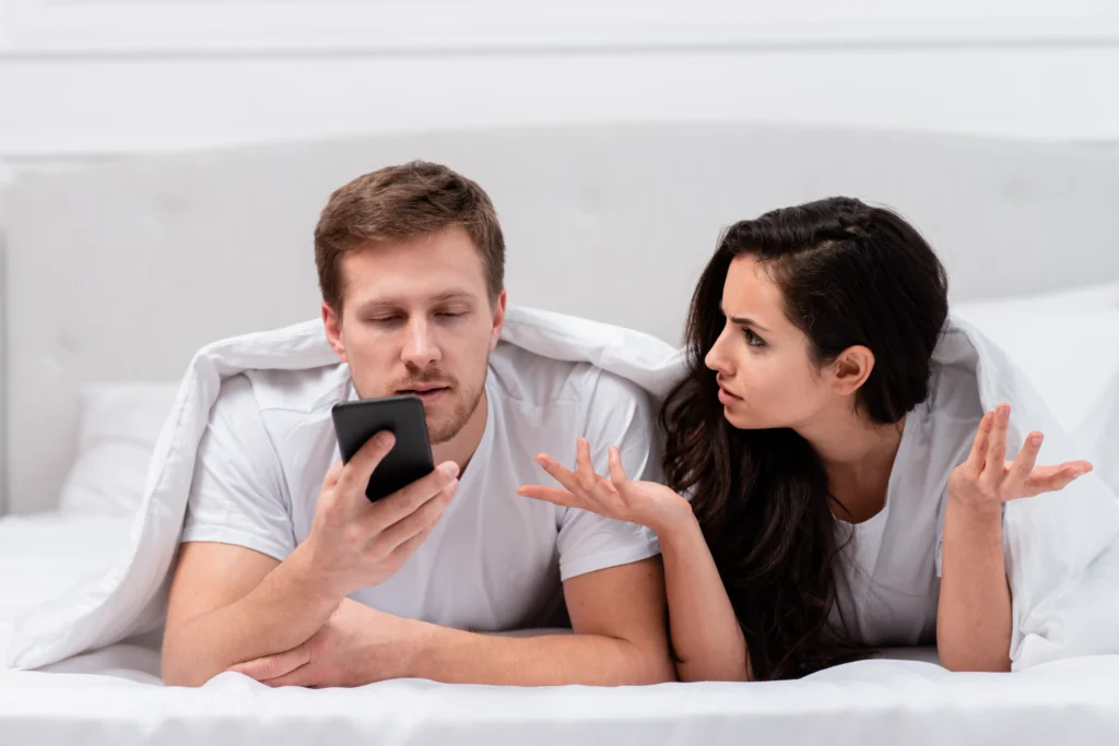 girlfriend being angry about her boyfriends addiction his phone