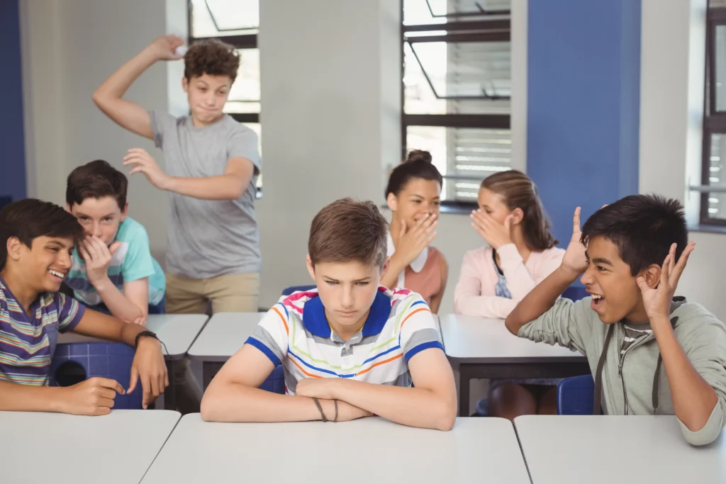 school friends bullying sad boy classroom