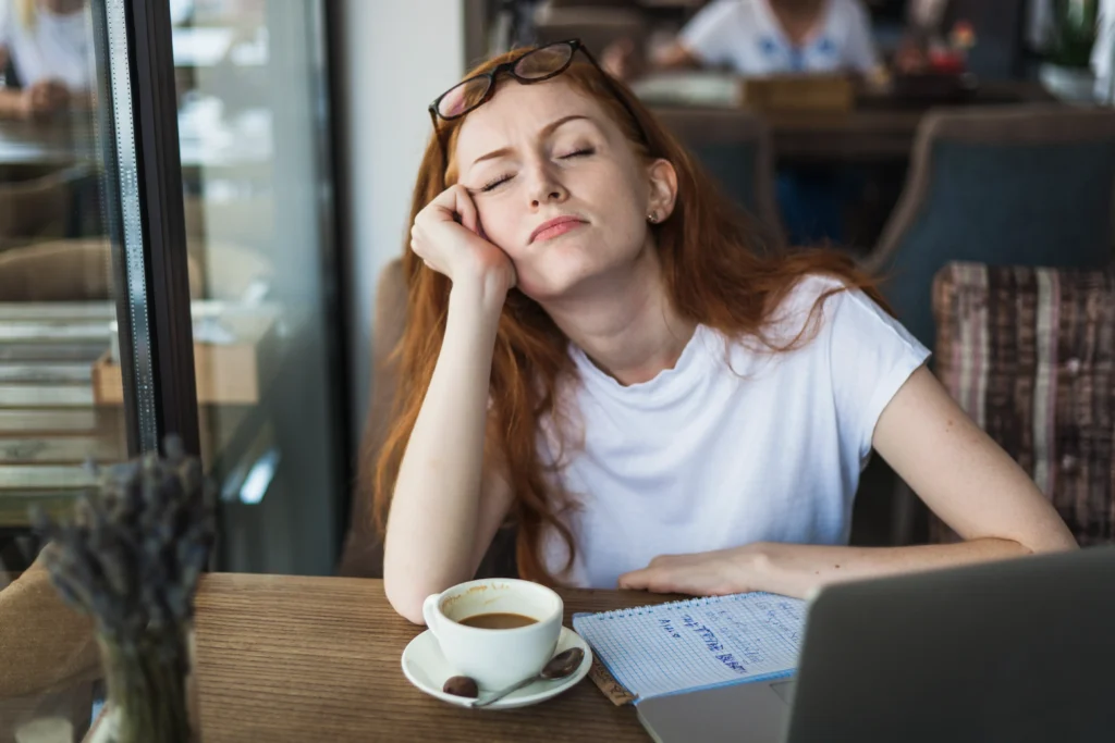 tired woman sitting table