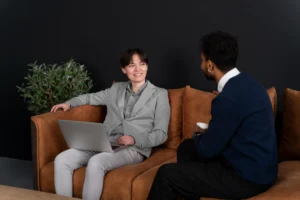 trans person working office with colleagues