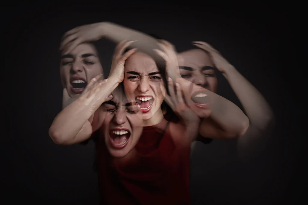 woman with personality disorder dark background multiple exposure