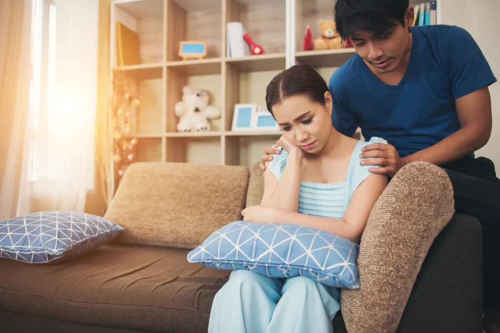young couple serious living room