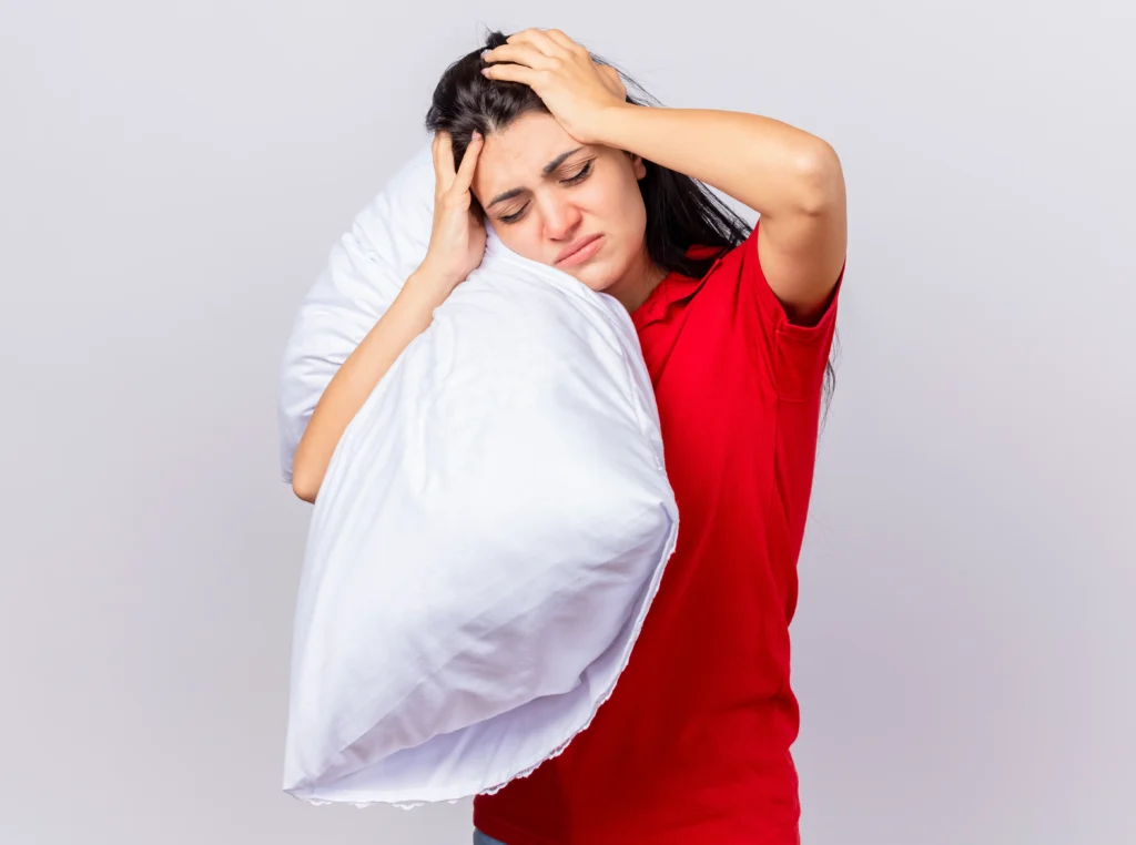 Sleep Therapy in Chennai 19 aching young caucasian ill girl holding pillow head with closed eyes isolated white background with copy space
